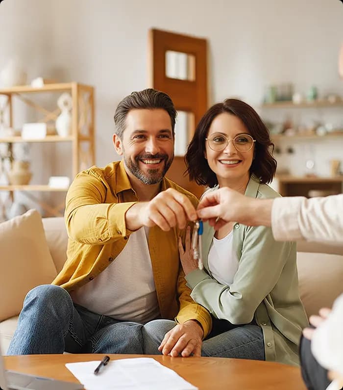 A couple being handed the keys to their newly acquired property in Portugal.