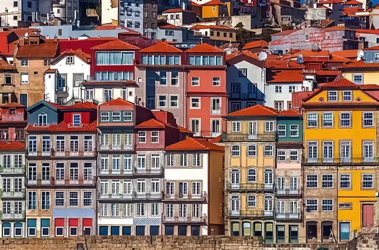 Colourful Ribeira façades in Porto, Portugal, with balconies and tiled details