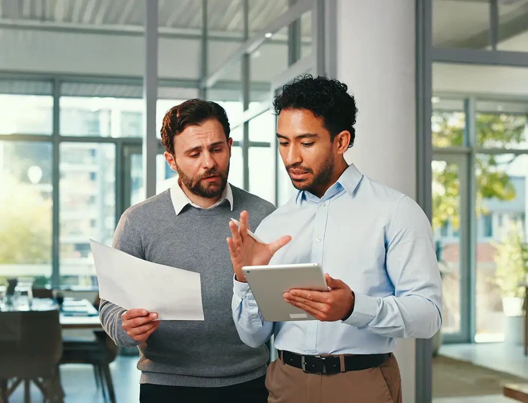 A consultant explaining a process to a client and answering his questions.