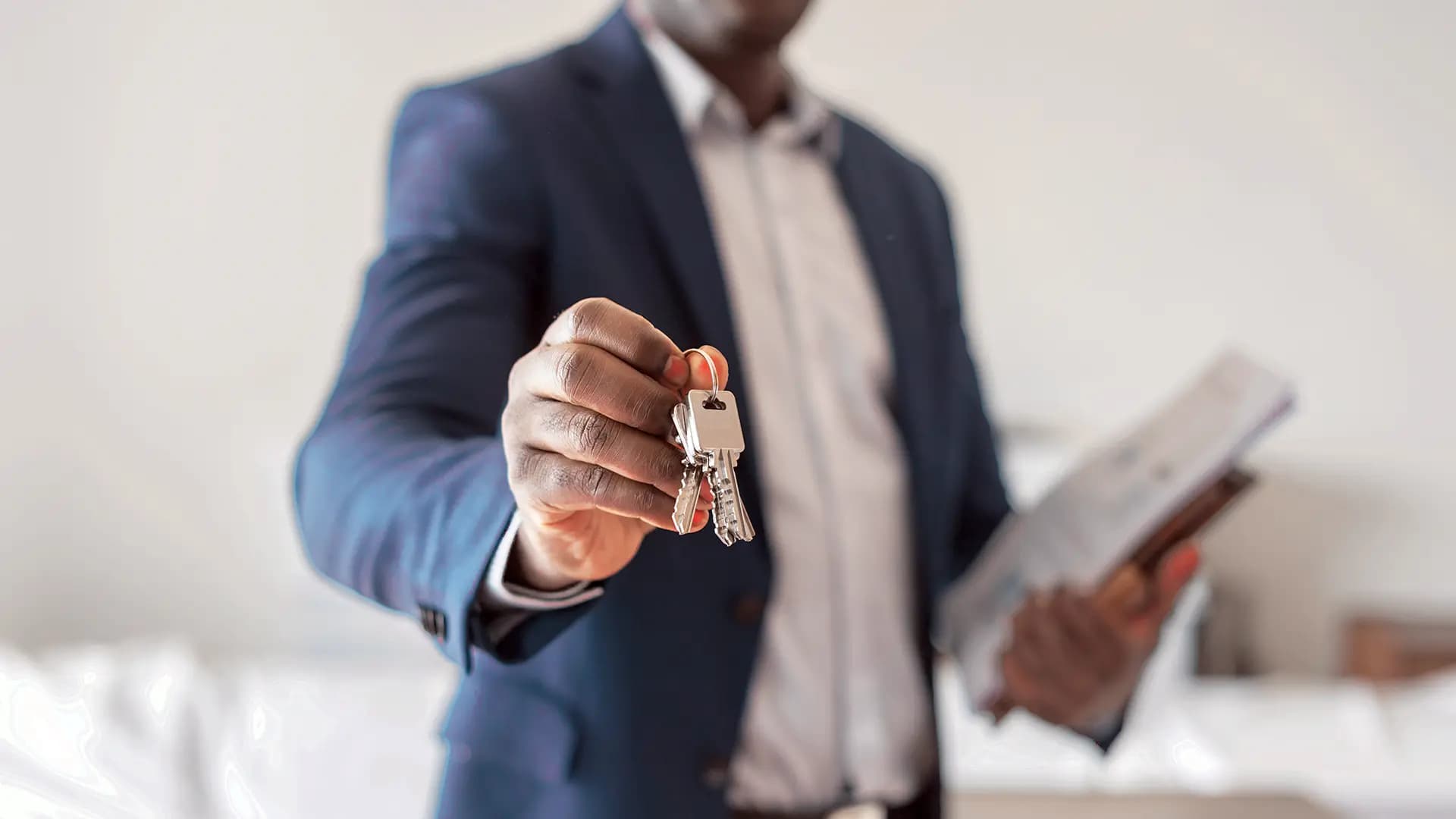 A property manager handles the keys of a house