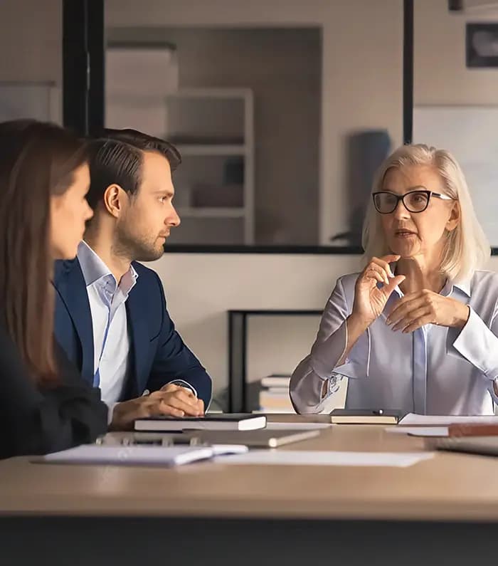A landlord lady makes a point regarding a particular issue in a condominium meeting